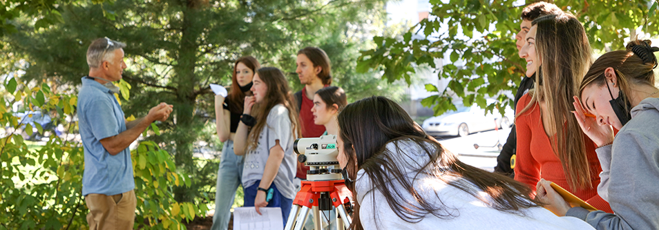 Ecology students using equipment outside